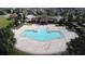 A pristine community pool is surrounded by a spacious sundeck and attractive landscaping at 4007 Green Sabal Dr, Orlando, FL 32824