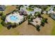 This aerial view features a community pool, playground, and well-manicured green spaces for outdoor enjoyment at 4007 Green Sabal Dr, Orlando, FL 32824
