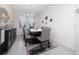 Elegant dining room with a dark wood table, upholstered chairs, and decorative wall accents at 4007 Green Sabal Dr, Orlando, FL 32824