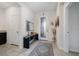 Bright foyer with neutral tile flooring, a decorative rug, and a glass-paneled front door at 4007 Green Sabal Dr, Orlando, FL 32824
