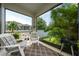 Inviting screened patio with comfortable seating and view of the fenced backyard at 4007 Green Sabal Dr, Orlando, FL 32824