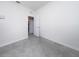 Clean, minimalist room with neutral walls and sleek tile flooring, offering a versatile space at 4007 Green Sabal Dr, Orlando, FL 32824