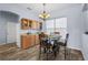 Cozy dining area features wooden cabinets, granite countertops, and a chandelier at 4125 Navigator Way, Kissimmee, FL 34746