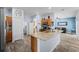 Open kitchen featuring granite counters, stainless appliances, and tile flooring at 4125 Navigator Way, Kissimmee, FL 34746