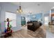 Living room with blue accent wall, modern furniture, and tile flooring at 4125 Navigator Way, Kissimmee, FL 34746