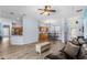 Open concept living room featuring tile floors, ceiling fan, and dining area at 4125 Navigator Way, Kissimmee, FL 34746