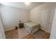 Cozy bedroom featuring wood flooring, a neutral color scheme, and comfortable furnishings at 4525 Sw 52Nd Cir # 103, Ocala, FL 34474