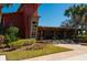 Inviting clubhouse featuring brick accents, lush landscaping, and a welcoming entrance at 4525 Sw 52Nd Cir # 103, Ocala, FL 34474