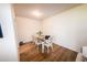 Cozy dining room with wood floors, a table set for six, and a view into the living area at 4525 Sw 52Nd Cir # 103, Ocala, FL 34474