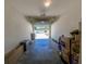 Spacious garage with high ceilings, concrete flooring and a motorized overhead door at 4525 Sw 52Nd Cir # 103, Ocala, FL 34474