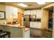 Community kitchen featuring granite countertops, stainless steel appliances, and ample cabinet space at 4525 Sw 52Nd Cir # 103, Ocala, FL 34474