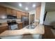 Well-equipped kitchen with stainless steel appliances, wooden cabinets, and ample counter space at 4525 Sw 52Nd Cir # 103, Ocala, FL 34474