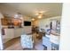 Open-concept living room with wood floors, connecting to the kitchen and dining area at 4525 Sw 52Nd Cir # 103, Ocala, FL 34474