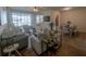 Inviting living room with wood floors, comfortable seating, and a view of the screened patio at 4525 Sw 52Nd Cir # 103, Ocala, FL 34474