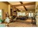 Beautiful community lounge featuring a stone fireplace, comfortable seating, and ample space for gatherings at 4525 Sw 52Nd Cir # 103, Ocala, FL 34474