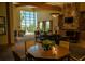 Welcoming lounge area with cozy seating, a stone fireplace, and ample natural light for relaxation and socializing at 4525 Sw 52Nd Cir # 103, Ocala, FL 34474