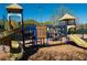 Community playground featuring slides, climbing structures, and play areas on a wood chip surface at 4525 Sw 52Nd Cir # 103, Ocala, FL 34474