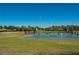 Sport courts featuring a sand volleyball court and two tennis courts with lights for evening play at 4525 Sw 52Nd Cir # 103, Ocala, FL 34474