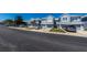 Street view of light blue townhouses with well-kept lawns and parked cars at 4525 Sw 52Nd Cir # 103, Ocala, FL 34474
