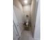 Half bathroom with ceramic tile flooring, a hanging plant, and neutral paint at 4525 Sw 52Nd Cir # 103, Ocala, FL 34474