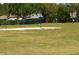 Community volleyball court with net and open field, located in a grassy area at 4525 Sw 52Nd Cir # 103, Ocala, FL 34474
