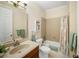 Neutral bathroom featuring a bath tub with shower, tiled floors, and vanity sink at 4561 Henry J Ave, St Cloud, FL 34772