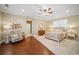 Cozy bedroom with hardwood floors, natural light, neutral color palette, and relaxing reading nook at 4561 Henry J Ave, St Cloud, FL 34772
