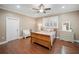 Charming bedroom with hardwood floors, neutral walls, and plantation shutters to enjoy the light at 4561 Henry J Ave, St Cloud, FL 34772