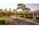Picturesque driveway leading to a charming home with mature trees and lush landscaping at 4561 Henry J Ave, St Cloud, FL 34772