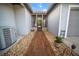 Charming home entryway with stone accents, gravel beds and a covered porch at 4561 Henry J Ave, St Cloud, FL 34772