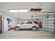 Spacious garage with ample lighting, storage, and an SUV parked inside at 4561 Henry J Ave, St Cloud, FL 34772