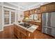 Beautiful kitchen with granite countertops, stainless steel appliances, and center island with cooktop at 4561 Henry J Ave, St Cloud, FL 34772