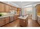 Well-equipped kitchen with stainless steel appliances, granite countertops, and custom cabinetry at 4561 Henry J Ave, St Cloud, FL 34772