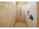 Updated bathroom features a walk-in shower with beautiful tile work, a shower niche, and bronze hardware at 4561 Henry J Ave, St Cloud, FL 34772