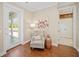 Cozy sitting area provides a comfortable view of the screened porch and features a reading nook at 4561 Henry J Ave, St Cloud, FL 34772