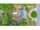 Aerial view showing property, boat, landscaping, and neighborhood from above on an expansive lot at 4765 Lake Shore Dr, St Cloud, FL 34772