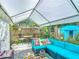 Relaxing outdoor patio area featuring comfortable seating under a tent at 4765 Lake Shore Dr, St Cloud, FL 34772