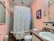 Vintage-style bathroom with a clawfoot tub and unique decor at 4765 Lake Shore Dr, St Cloud, FL 34772