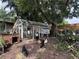 Backyard chicken coop offers fresh eggs in a serene, shaded environment at 4765 Lake Shore Dr, St Cloud, FL 34772