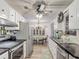 Bright kitchen with stainless steel appliances and a view into the dining area at 4765 Lake Shore Dr, St Cloud, FL 34772