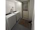 Bright laundry room featuring a newer washer and dryer for convenient in-home laundry at 4765 Lake Shore Dr, St Cloud, FL 34772