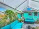 Relaxing covered patio with comfortable seating, perfect for outdoor living and entertaining at 4765 Lake Shore Dr, St Cloud, FL 34772