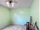 Clean, unfurnished room featuring tile flooring and a ceiling fan at 4765 Lake Shore Dr, St Cloud, FL 34772