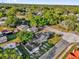 Aerial view of a home with a sprawling backyard and mature trees providing shade and privacy at 503 New York Ave, St Cloud, FL 34769