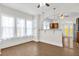 Bright dining area with large windows, pendant lighting, and seamless flow to the kitchen at 503 New York Ave, St Cloud, FL 34769