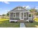 Charming home features a cozy screened porch, offering a perfect spot to relax and enjoy the outdoors at 503 New York Ave, St Cloud, FL 34769