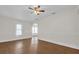 Bright living room boasts wood-look floors, neutral walls, and ample natural light at 503 New York Ave, St Cloud, FL 34769