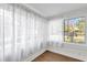 Bright sunroom featuring lots of natural light, beautiful windows and hardwood floors at 503 New York Ave, St Cloud, FL 34769