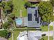 Aerial view of home showcasing the backyard, pool, and solar panels on the roof at 5123 Lighthouse Rd, Orlando, FL 32808