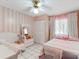 Charming bedroom with a playful theme, cute decor, and closet space at 5123 Lighthouse Rd, Orlando, FL 32808